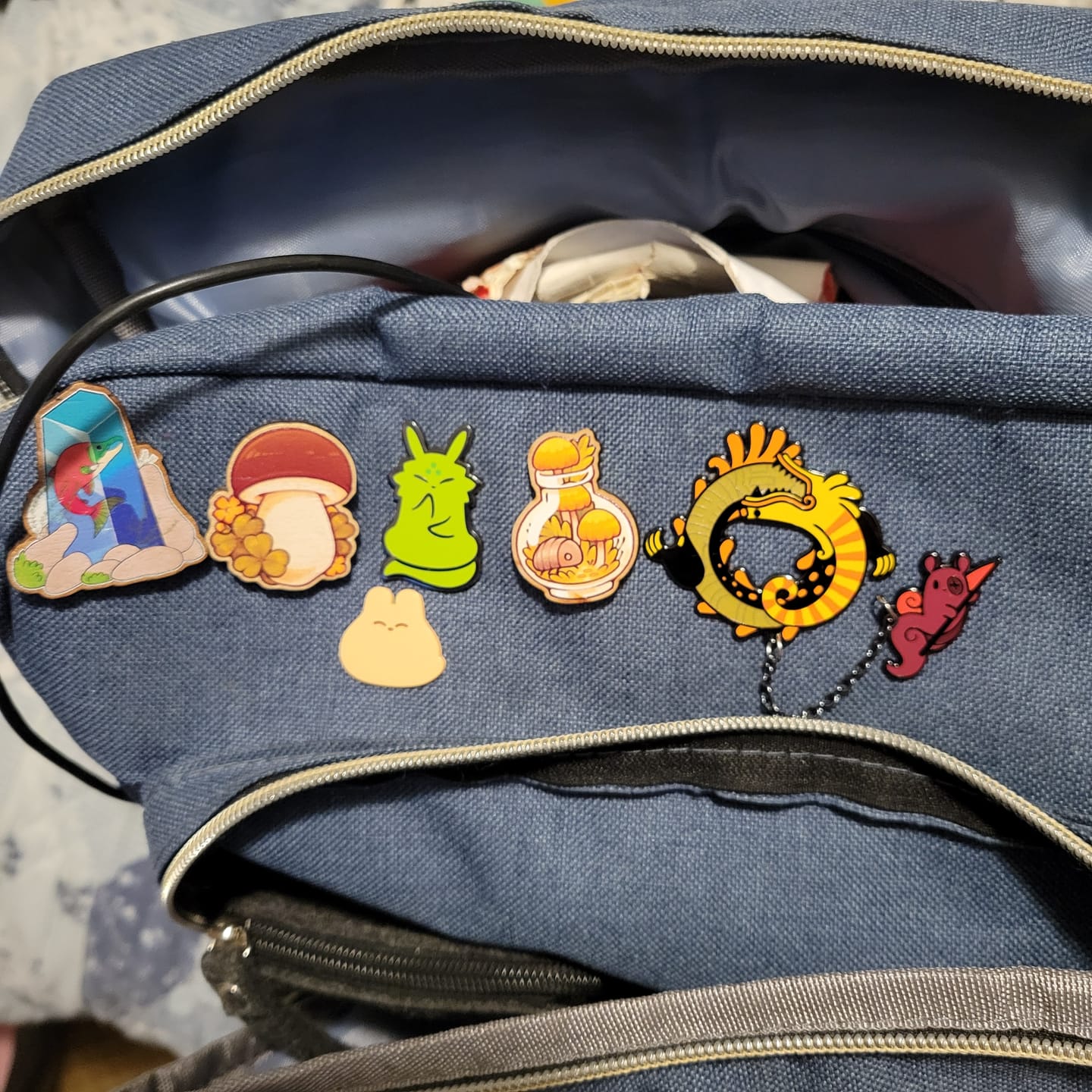 Customer photo review of Rain World - Yellow Lizard Hanger Pin