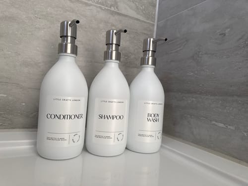 Customer photo review of Set of 3 Bathroom Reusable Milky White Glass Bottles 500 ML with Metal Pump