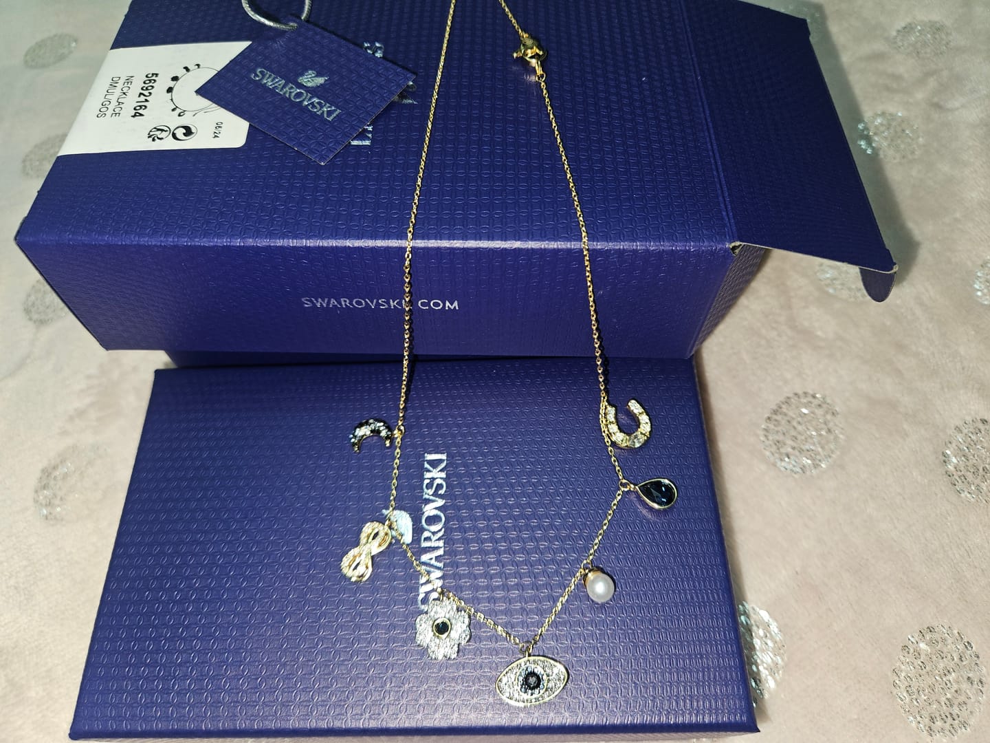 Customer photo review of COLLAR GARGANTILLA SWAROVSKI SIMBOLICA LUNA INFINITO TREBOL OJO HERRADURA ORO