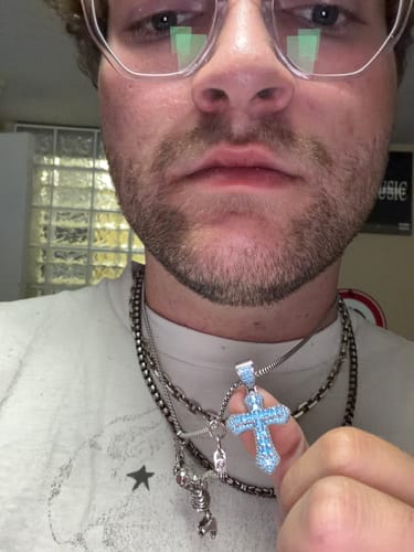 Customer photo review of BLUE CROSS PENDANT.