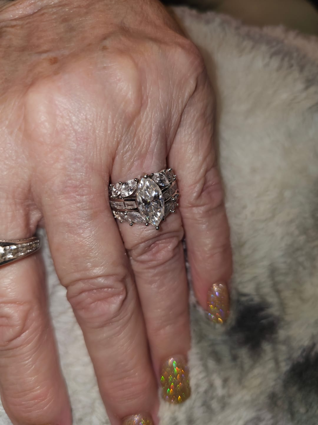 Customer photo review of Marquise Cut Moissanite And Enhanced Side Stone Engagement Ring