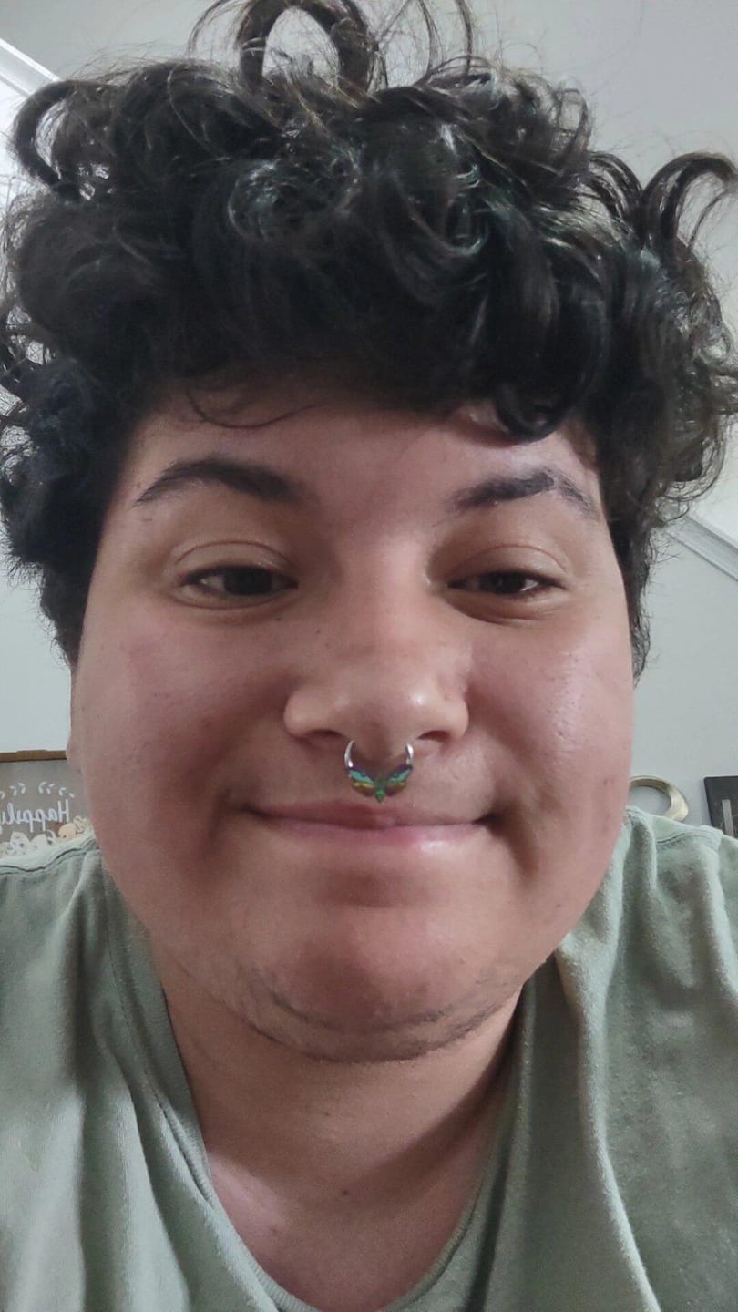 Customer photo review of Rainbow Death's Head Moth Septum + Daith Ring