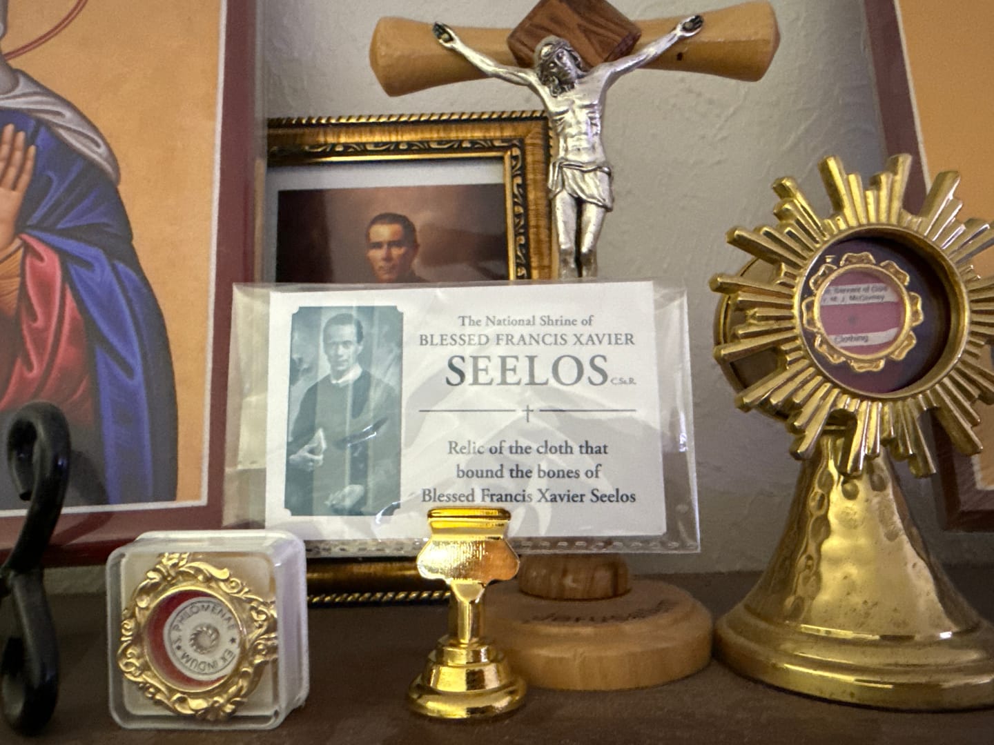 Customer photo review of Holy Card Stand – Stand Only – (Holy Card Not Included) – Brass-Colored Steel Stand to Display Holy Card