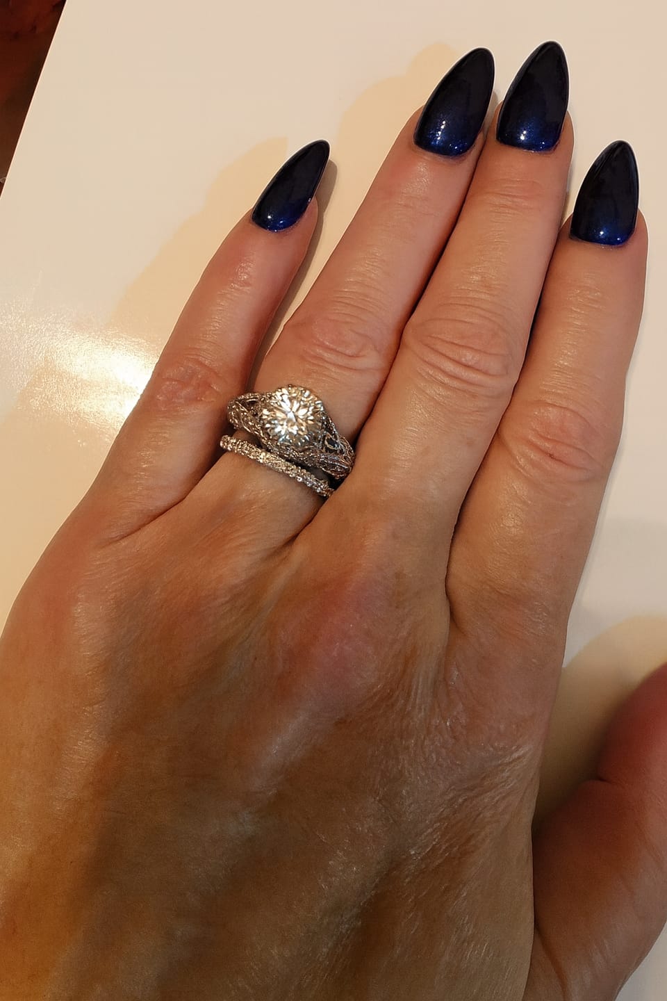 Customer photo review of Vintage Moissanite Pave Open Scroll Accents Engagement Ring