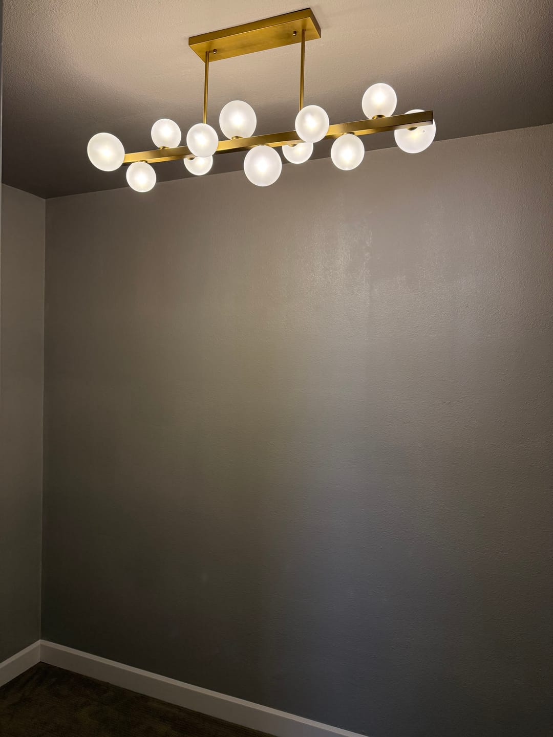 Customer photo review of 12-Light Brass Frosted Glass Bubble Linear Chandelier