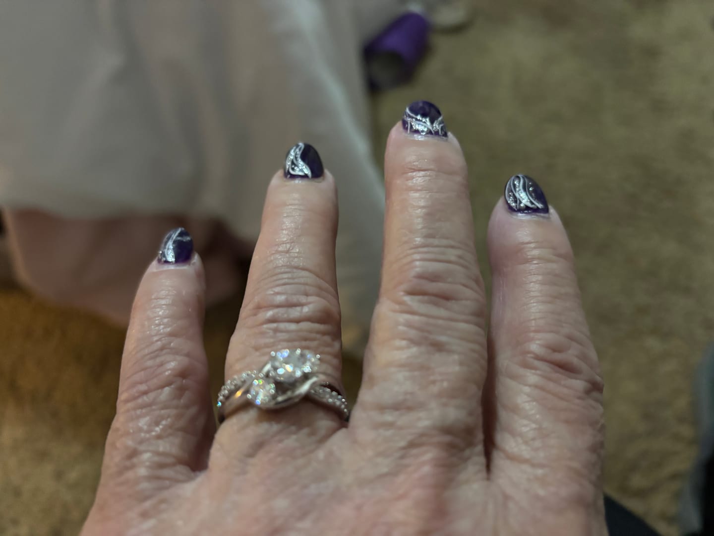 Customer photo review of Swirl Three Stone Moissanite Twisted Pave Engagement Ring
