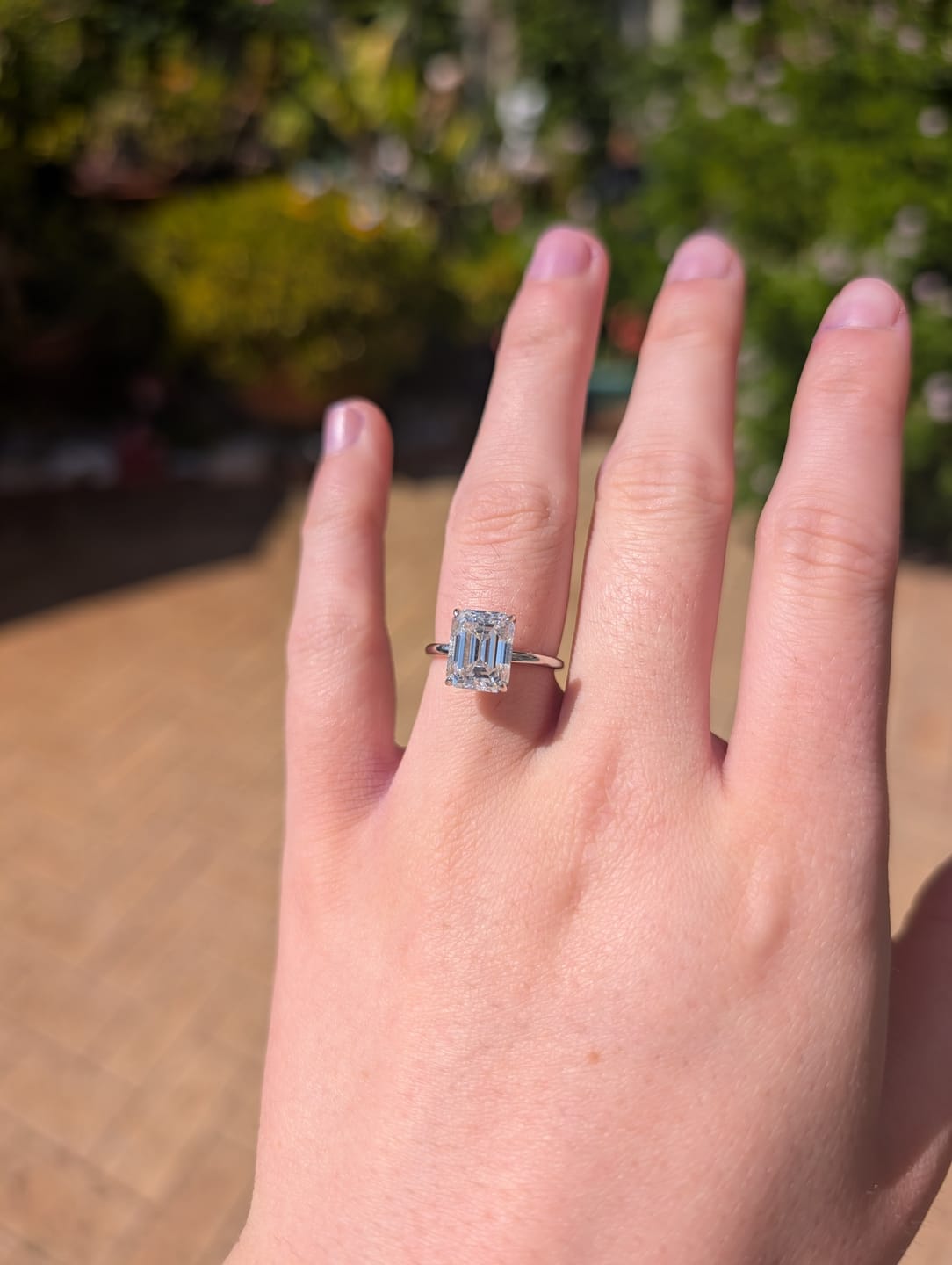Customer photo review of Timeless 4 Carat Emerald Cut Solitaire Ring | Moissanite | 18K Gold Plated