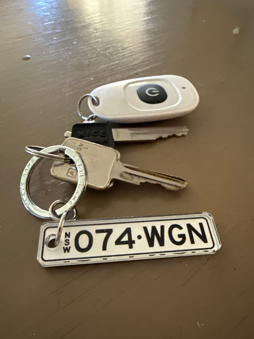 Customer photo review of NSW Colour on White Licence Plate Custom Keychain