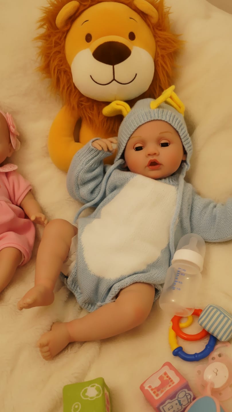 Customer photo review of Interactive Baby Doll – Moves Face While Feeding