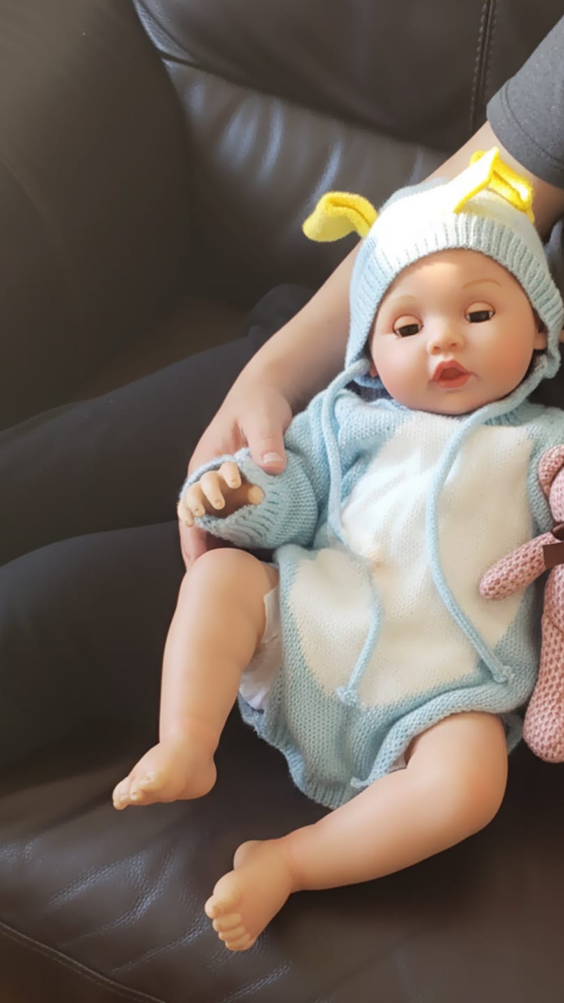 Customer photo review of Interactive Baby Doll – Moves Face While Feeding