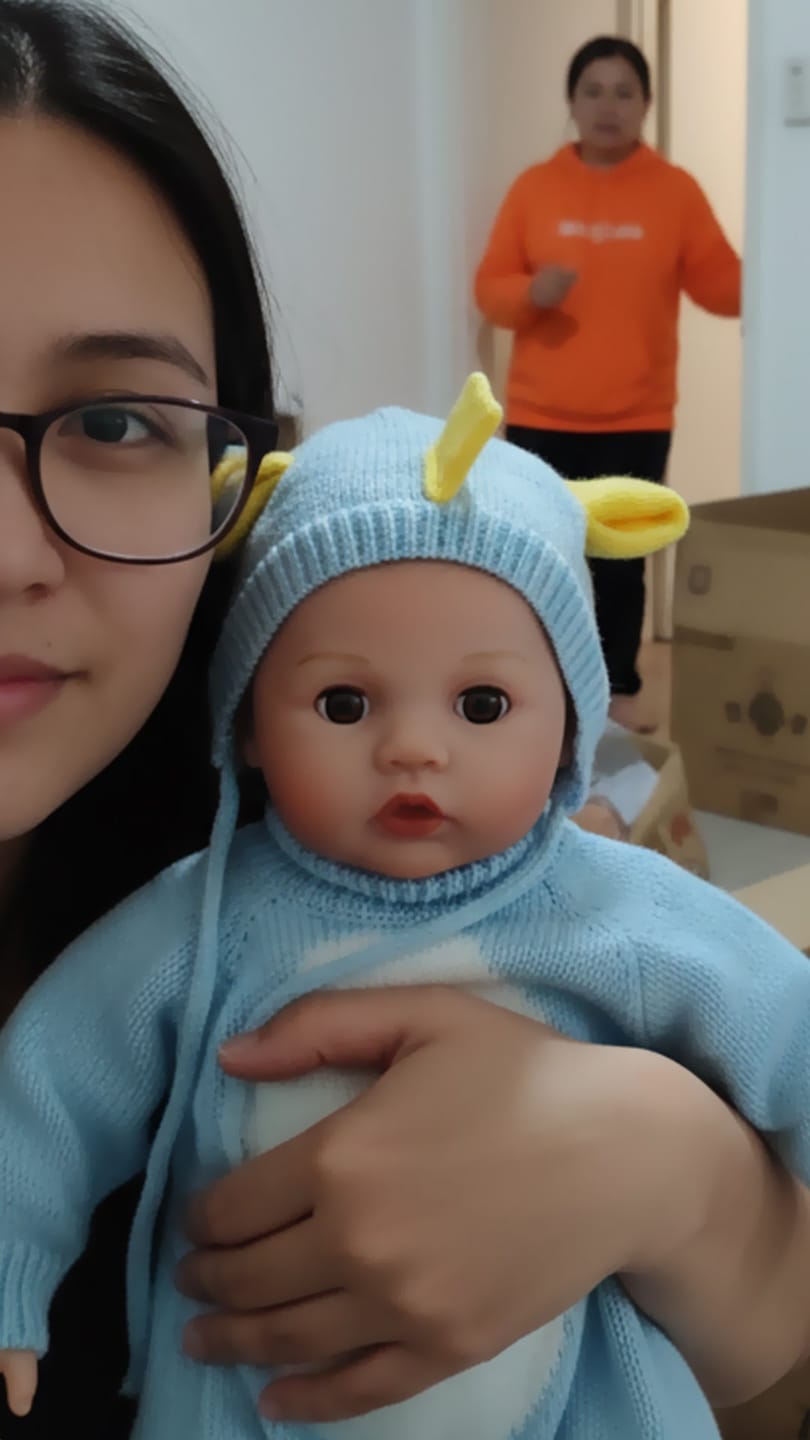 Customer photo review of Interactive Baby Doll – Moves Face While Feeding