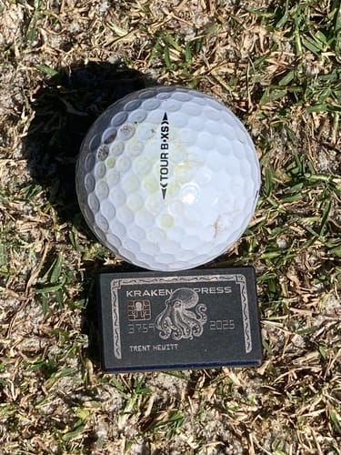 Customer photo review of The Black Card | Kraken Titanium Golf Ball Marker