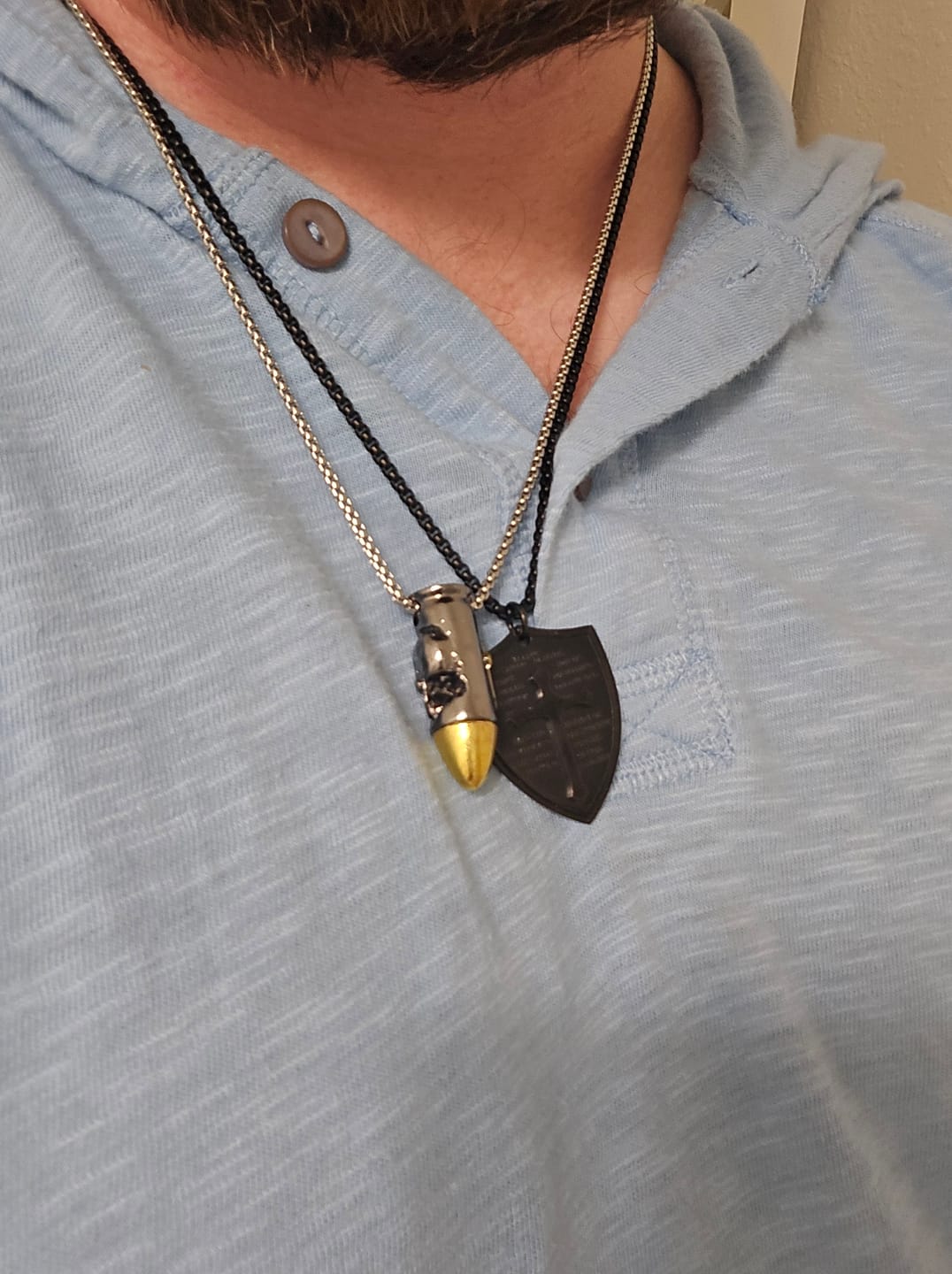 Customer photo review of Christianartworkshop Skull and Crossbones Bullet Pendant Necklace