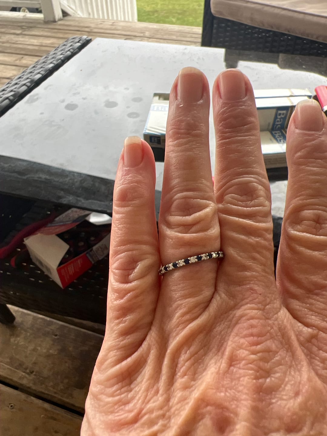 Customer photo review of Alternating Moissanite And Sapphire Eternity Wedding Band Ring