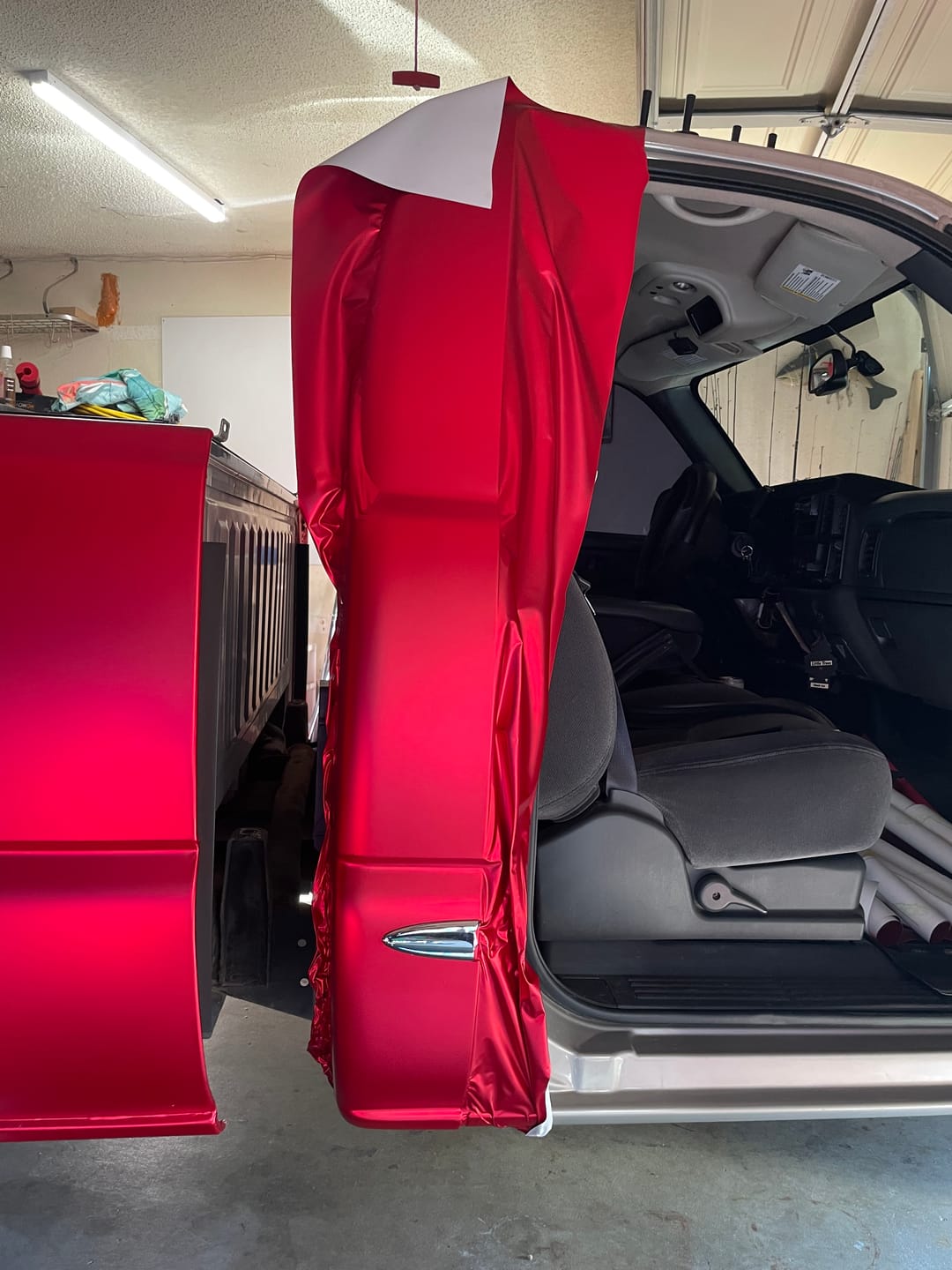 Customer photo review of Satin Chrome Prismatic Red Vinyl Wrap
