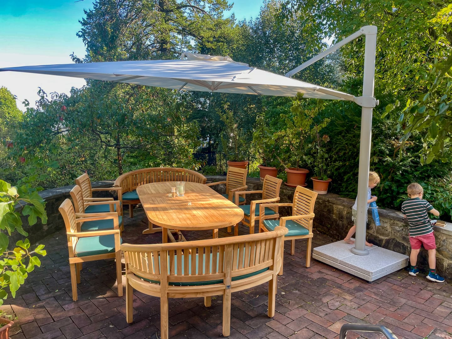 Customer photo review of Teak Oval 2m to 3m Extending Table with 8 Oxford Stacking Chairs & 2 San Francisco Benches