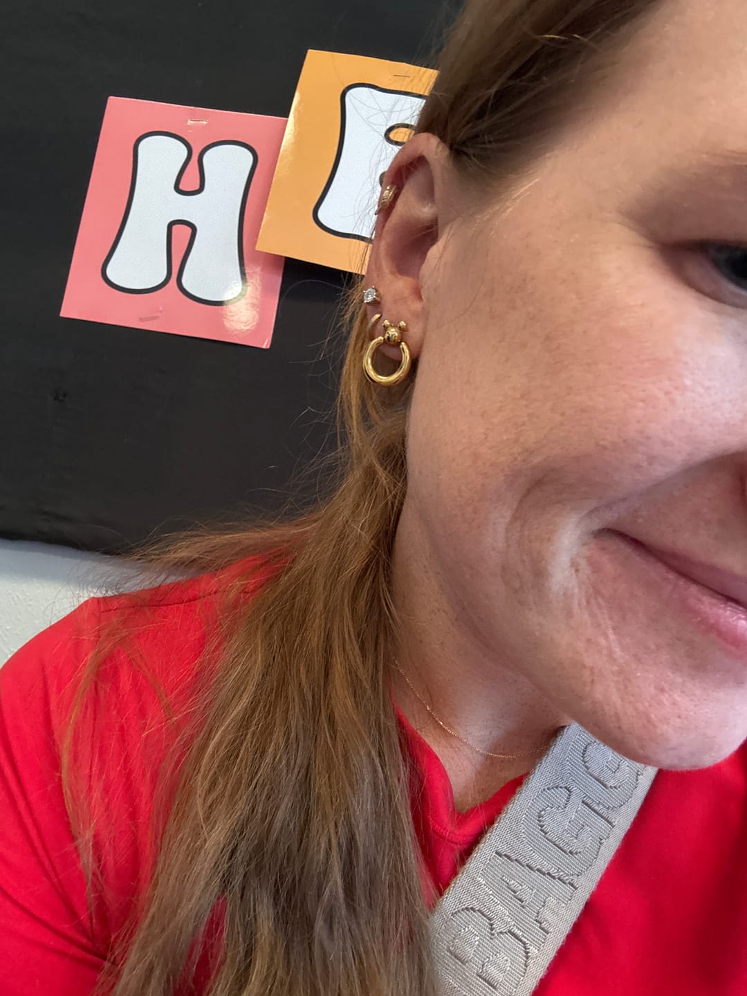 Customer photo review of Mini Leader of the Club Earrings