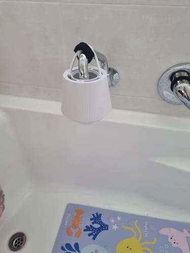 Advance Bath Filter hanging from a bath spout