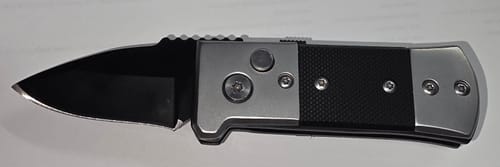 Customer photo review of Mini Push Button Switchblade Pocket Knife