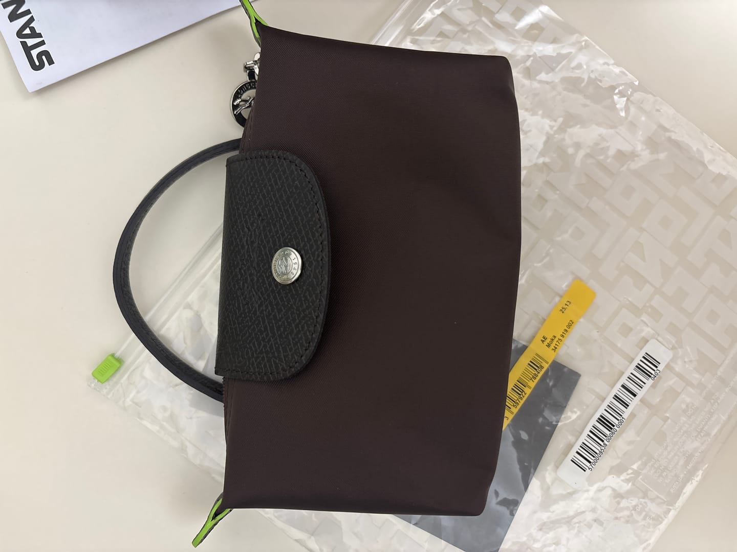 Customer photo review of Longchamp Le Pliage Green Pouch With Handle-Mocha
