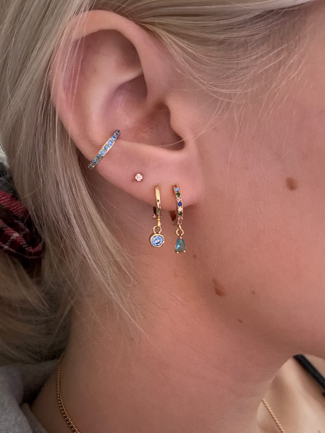 Customer photo review of Ottillie Gold Rainbow Raindrop Huggie Earrings