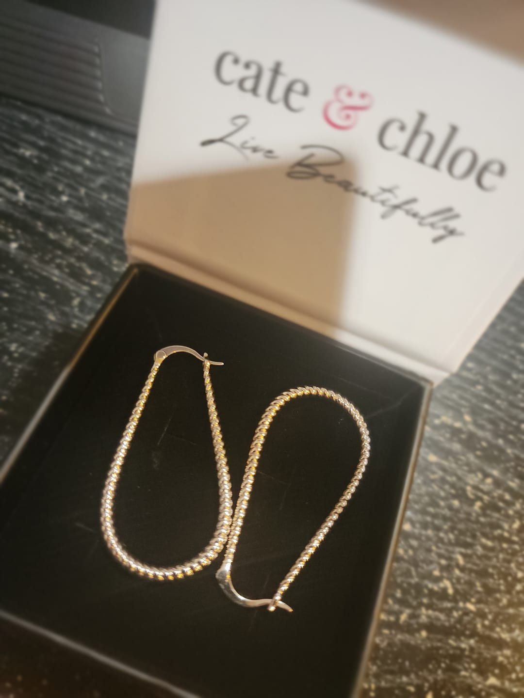 Customer photo review of Angelica 18k White Gold Plated 45mm Twisted U-Shaped Hoop Earrings