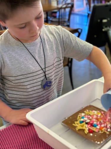 Customer photo review of Dino Pendant Sensory Calming Chew