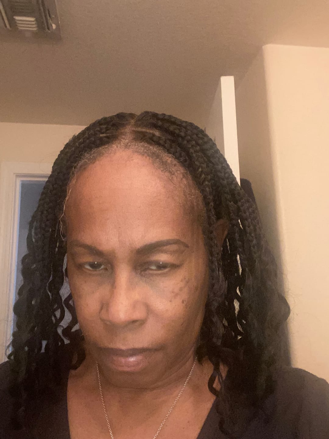 Customer photo review of Nina - Short Pre Bleached Swiss HD Full Lace Knotless Box Braided Wig With Human Hair Curly Ends