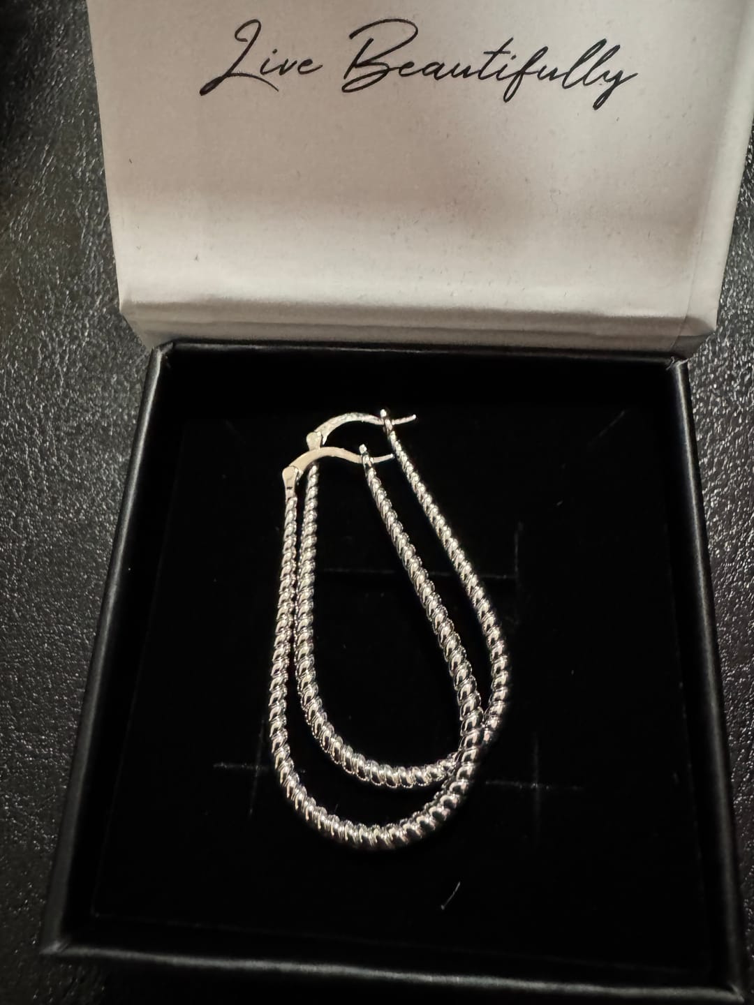 Customer photo review of Angelica 18k White Gold Plated 45mm Twisted U-Shaped Hoop Earrings