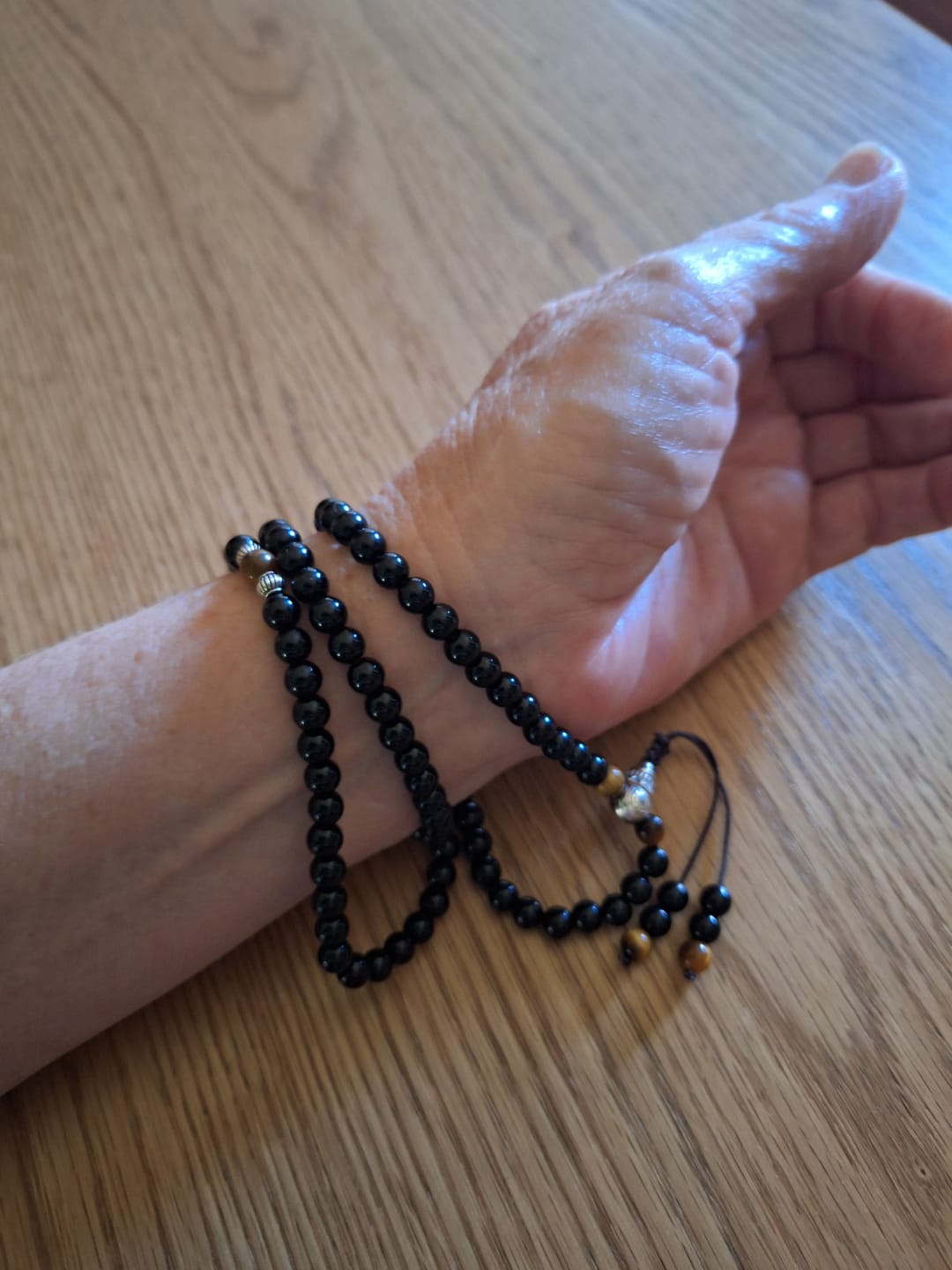 Customer photo review of Buddha Stones Black Obsidian Tiger Eye Blessing Mala Bracelet