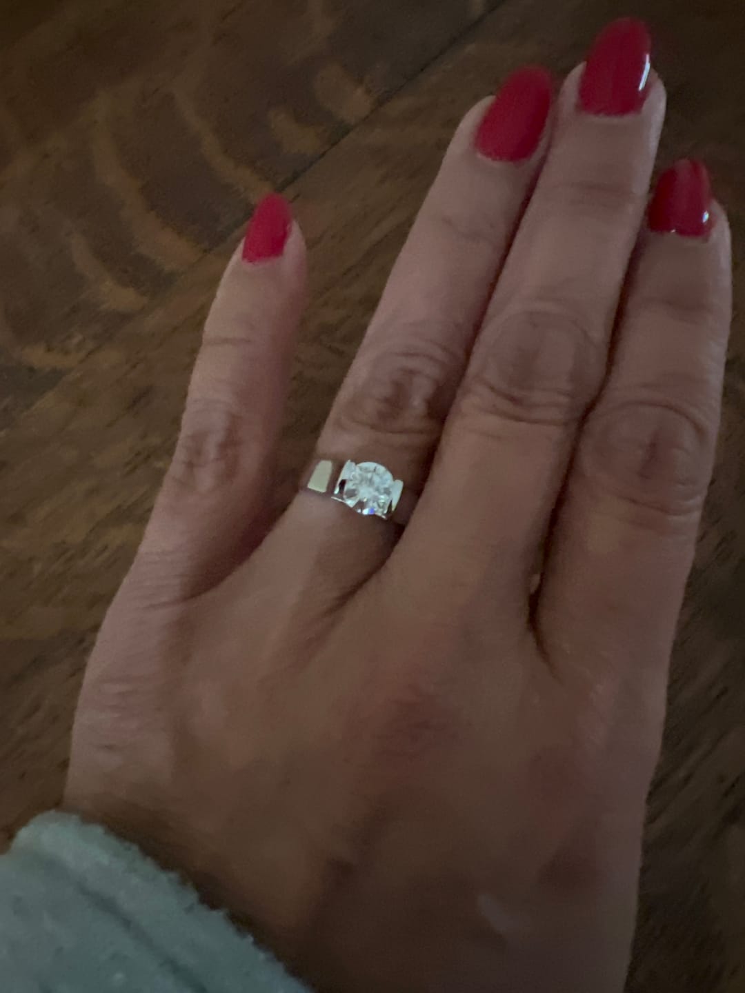 Customer photo review of Solitaire Round Moissanite Bar Set Engagement Ring