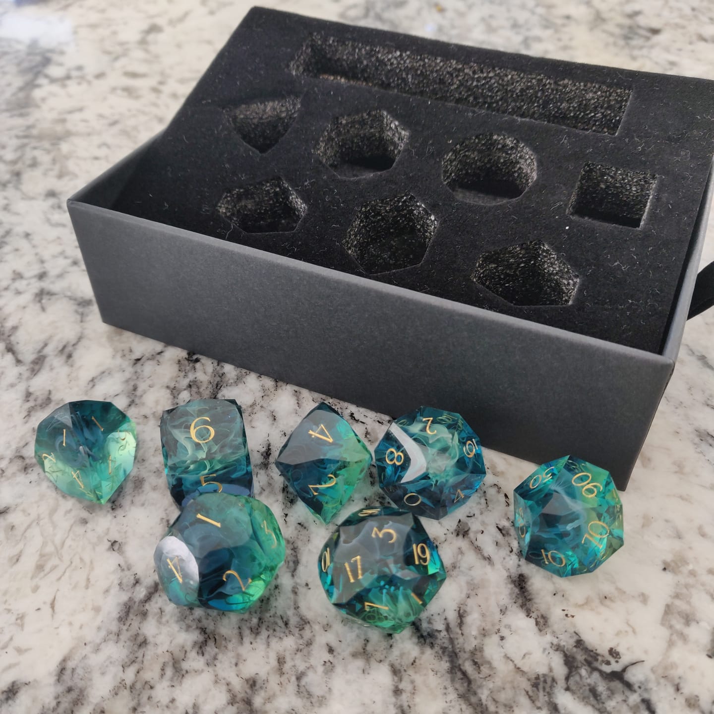 Customer photo review of URWizards D&D Resin Tidebound Fate Engraved Dice Set Multi-faceted Style