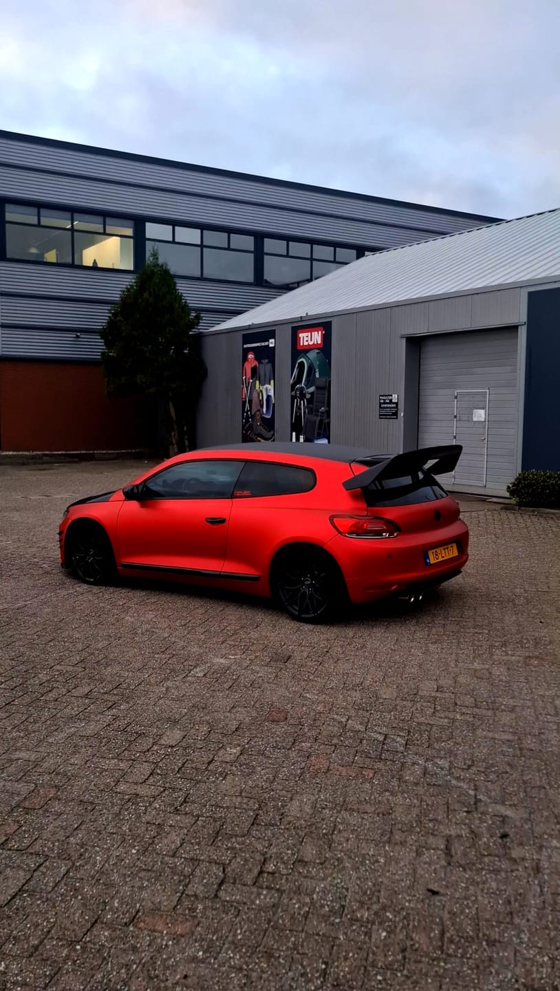 Customer photo review of Satin Chrome Prismatic Red Vinyl Wrap