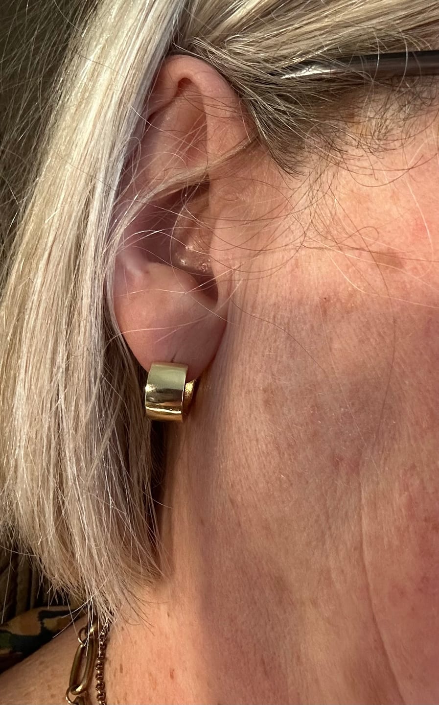 Customer photo review of Thick Huggie Hoop Earrings