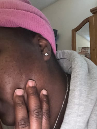 Customer photo review of VVS Moissanite Solitaire Stud Earrings