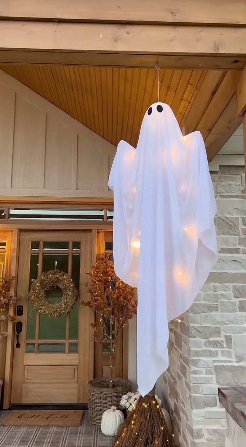Customer photo review of Hanging Swing Ghost Decoration Halloween 2025 Porch Lights