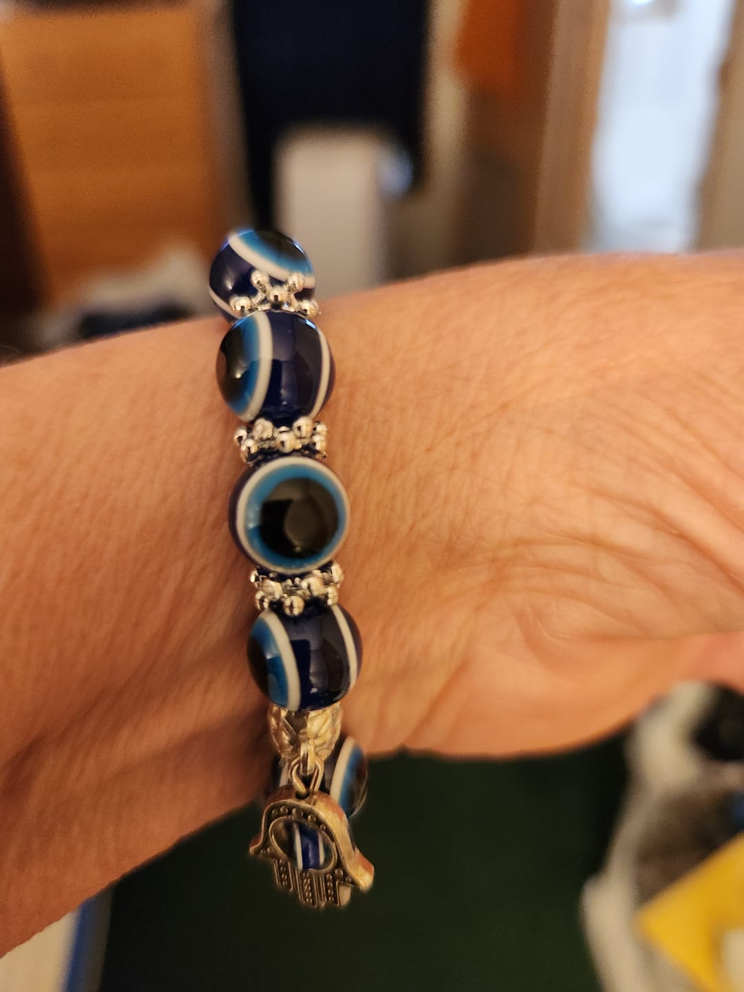 Customer photo review of Blue Hamsa Hand Evil Eye Bracelet