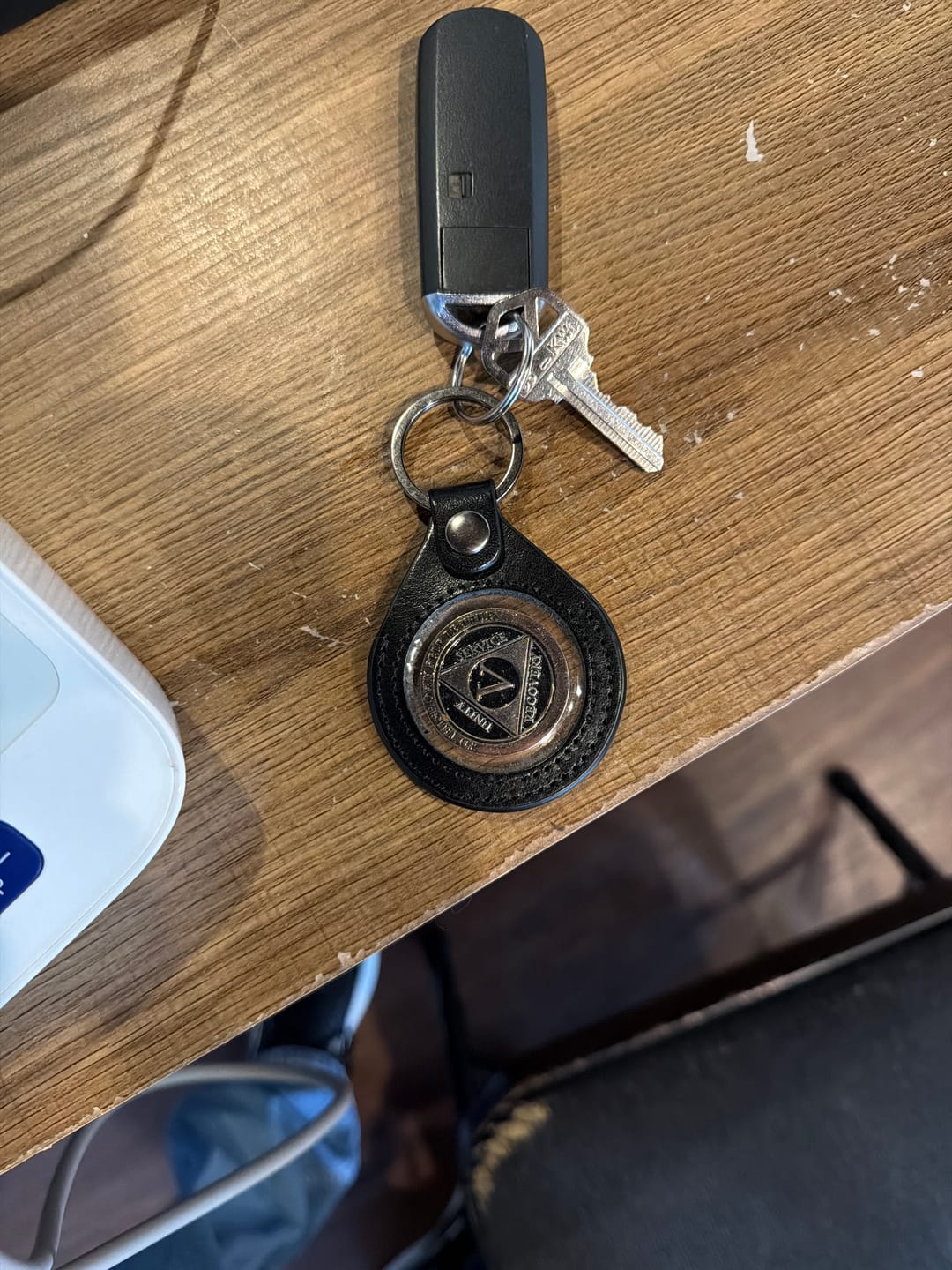 Customer photo review of Sobriety Mint Genuine Leather 40mm AA Medallion Keychain Holder - Recovery Chip/Coin/Token Holder - Black