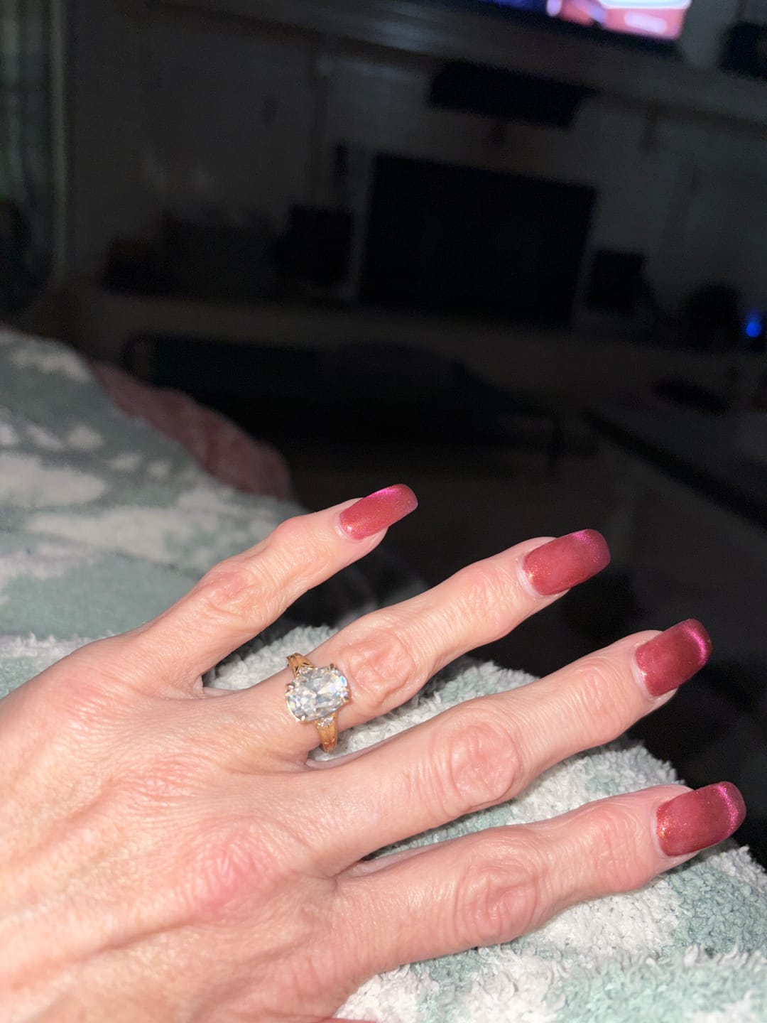 Customer photo review of Taylor 4 Carat Elongated Cushion Cut Moissanite Diamond Ring in 14k Yellow Gold