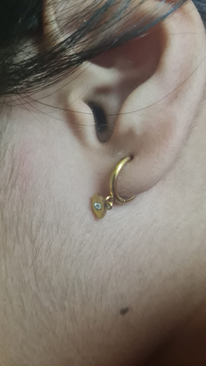 Customer photo review of Tiny Iris Star Hoop Earrings