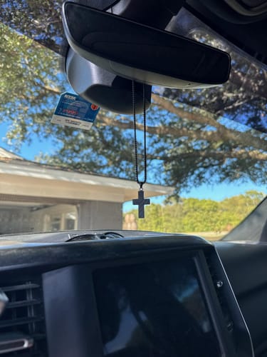 Customer photo review of In God We Trust - American Flag Cross  Necklace: Helps Pair Veterans With A Service Dog Or Shelter Dog