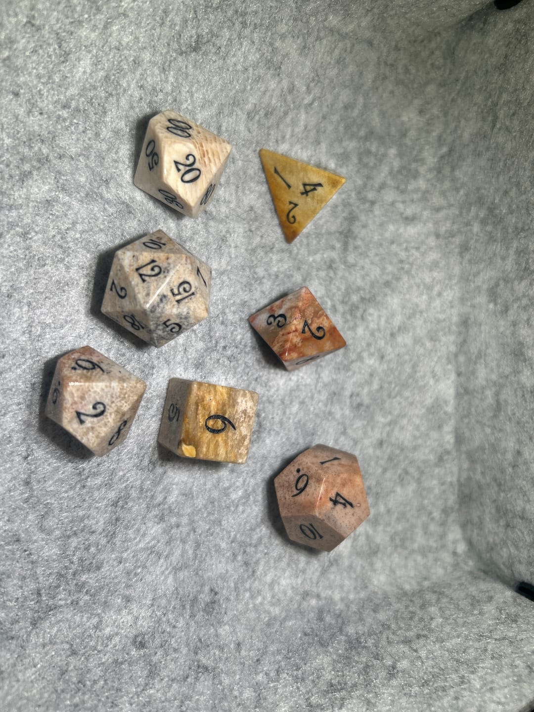 Customer photo review of URWizards D&D Coral Fossil Gemstone Engraved Dice Set