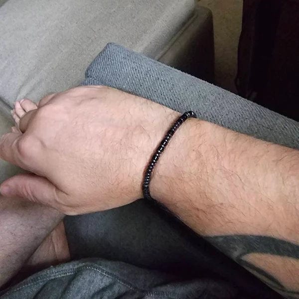 Customer photo review of Obsidian 'Strong as Fuck' Morse Code Bracelet