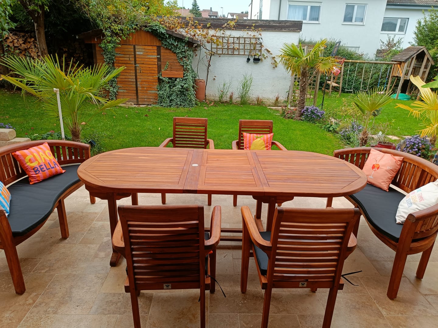 Customer photo review of Teak Oval 2m to 3m Extending Table with 8 Oxford Stacking Chairs & 2 San Francisco Benches