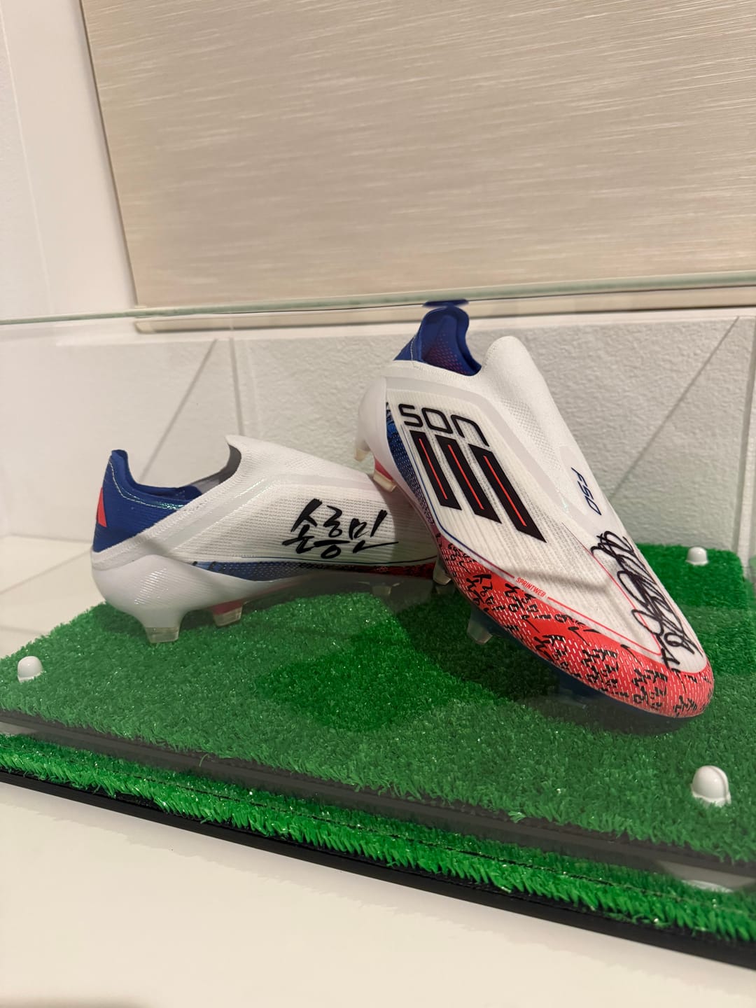 Customer photo review of Large Display Case for Small Basketball High Top Shoes, Sneaker(s), Lacrosse, Soccer, & Football Cleats with Clear Case No Wall Mount