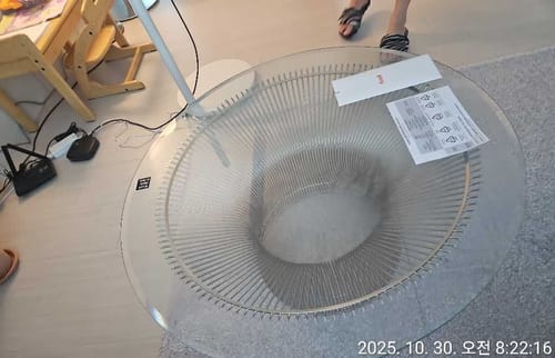 Customer photo showing glass top and wire base