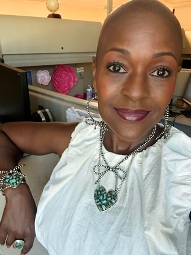 Customer photo review of Handmade Sterling Silver White Buffalo Turquoise Post Earrings with Signed Nizhoni (9)