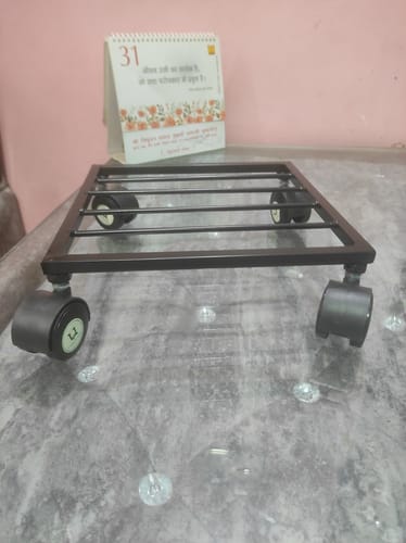 Customer photo review of United Crafts Rozy Wheel Pot Stands for Planters