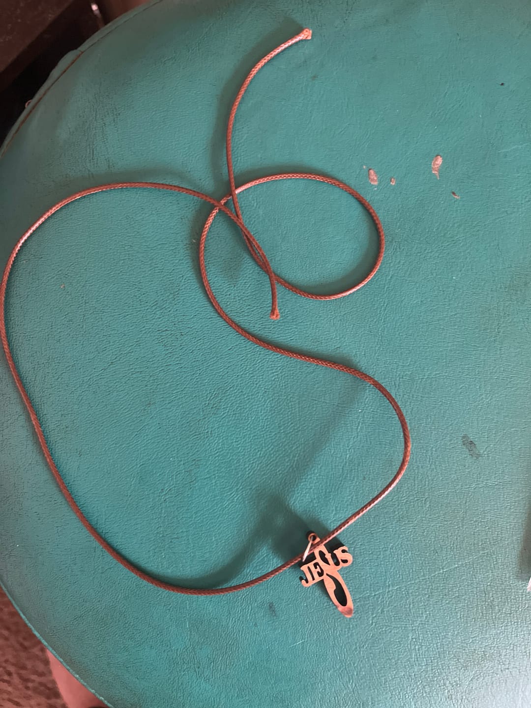 Customer photo review of Holy Land Jesus Name Cross Pendant
