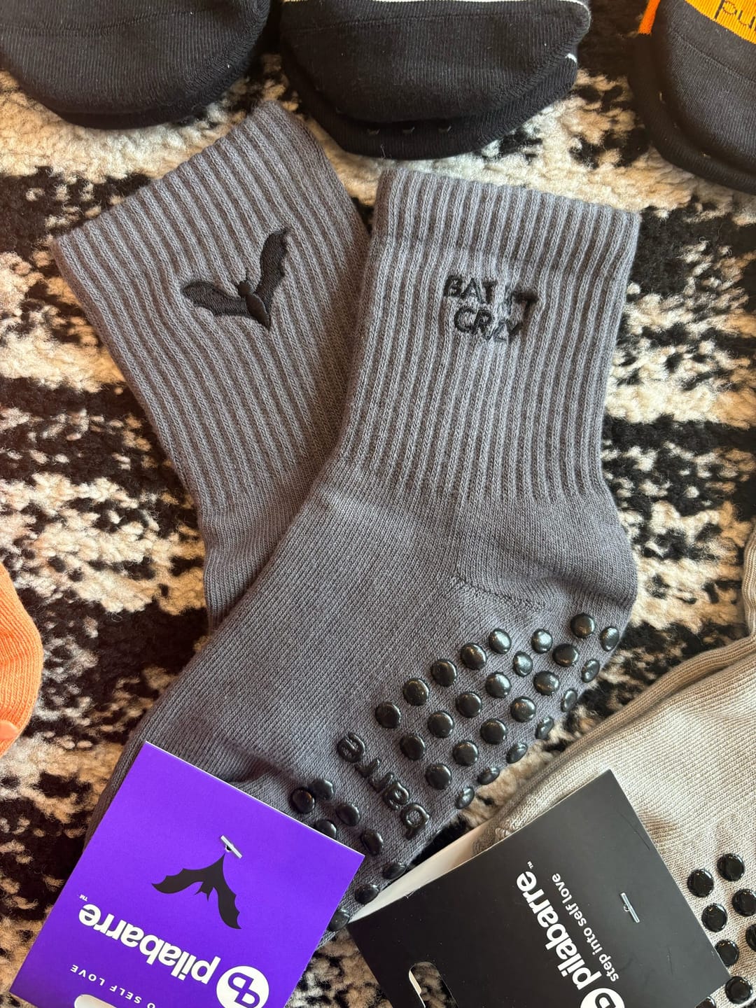Customer photo review of Bat Sh*t Crazy Halloween Grip Socks